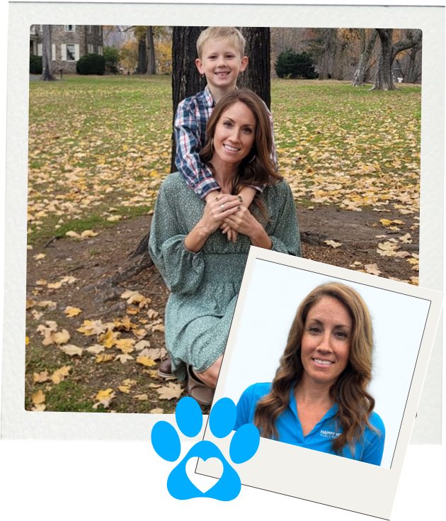 A woman and a boy are posing for a picture with a dog.