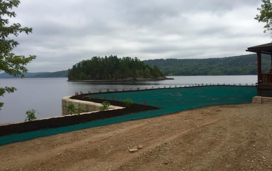 A lake with a small island in the middle of it