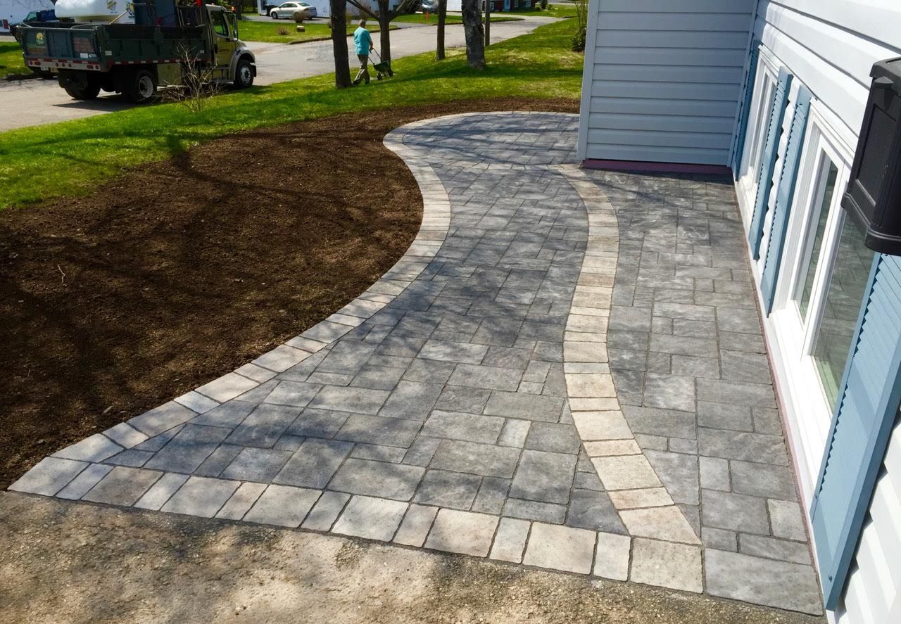 A walkway is being built in front of a house.