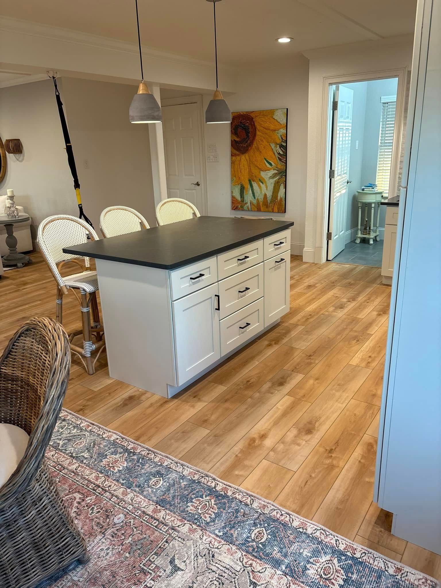 A kitchen with a large island in the middle of the room.