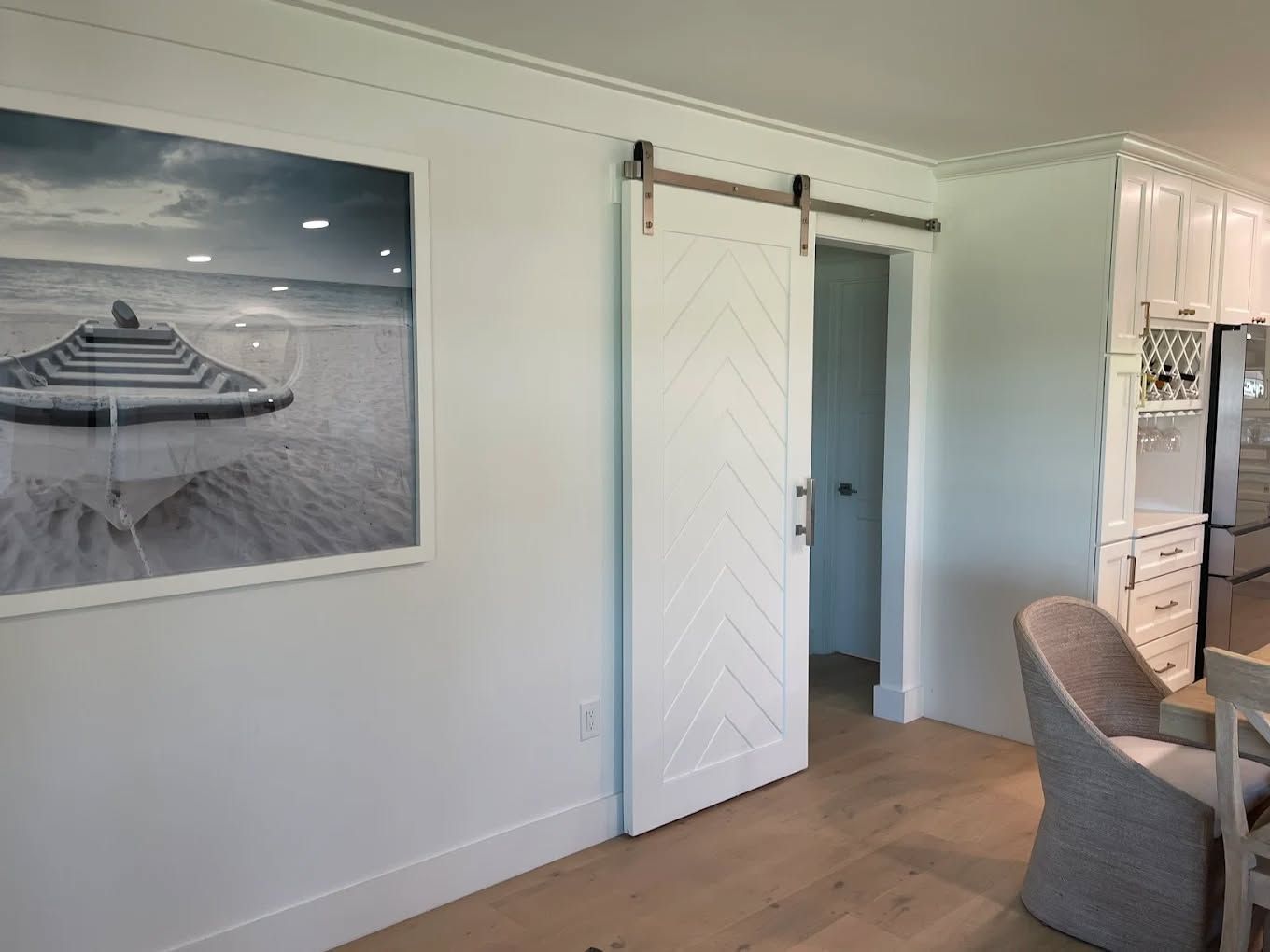 A bathroom with a sink and a walk in shower.