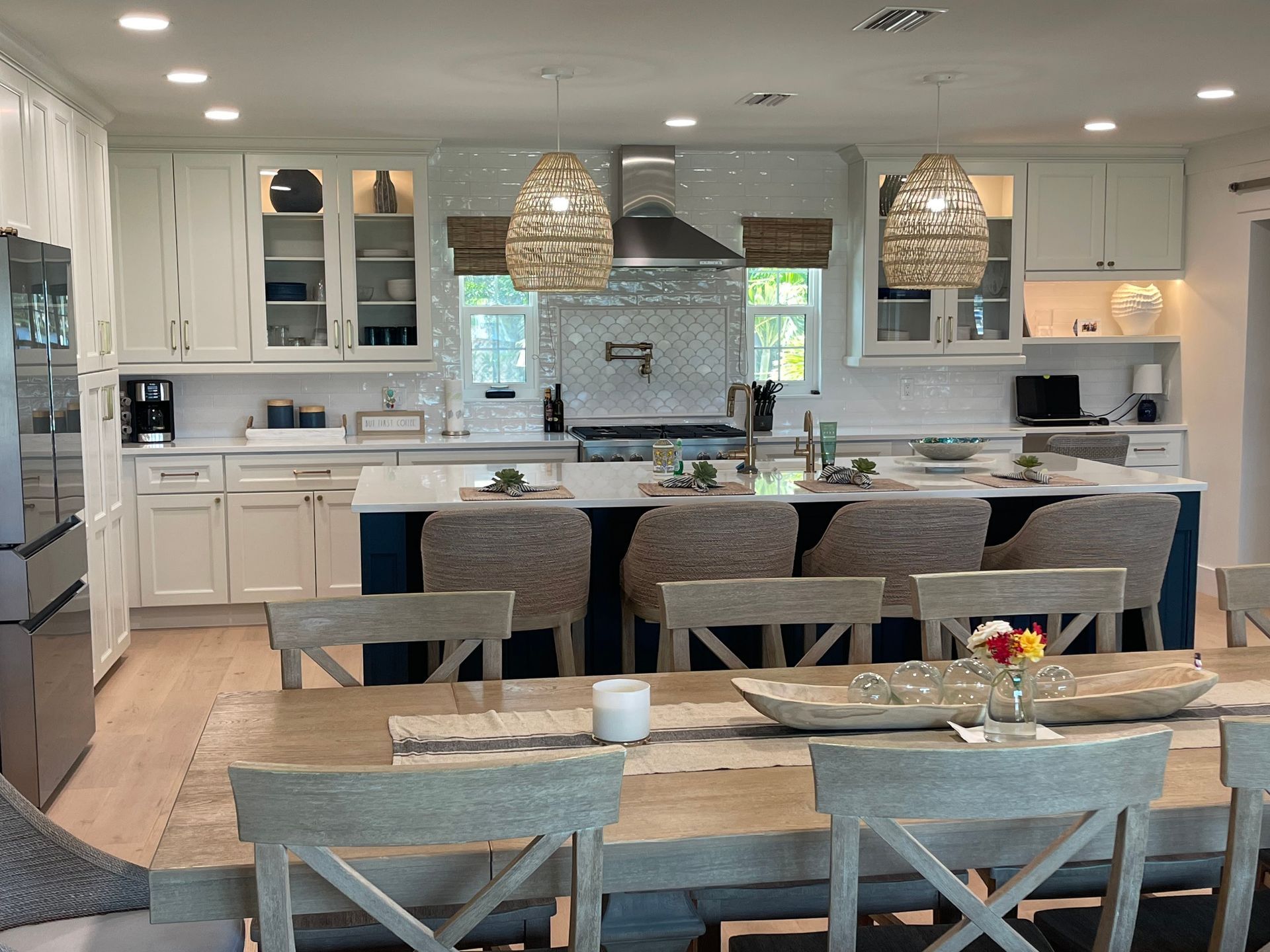 A kitchen with a table and chairs in it