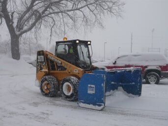 Pushing Snow with Skid Steer — Highland, IN — Allen Landscape in Highland, LLC
