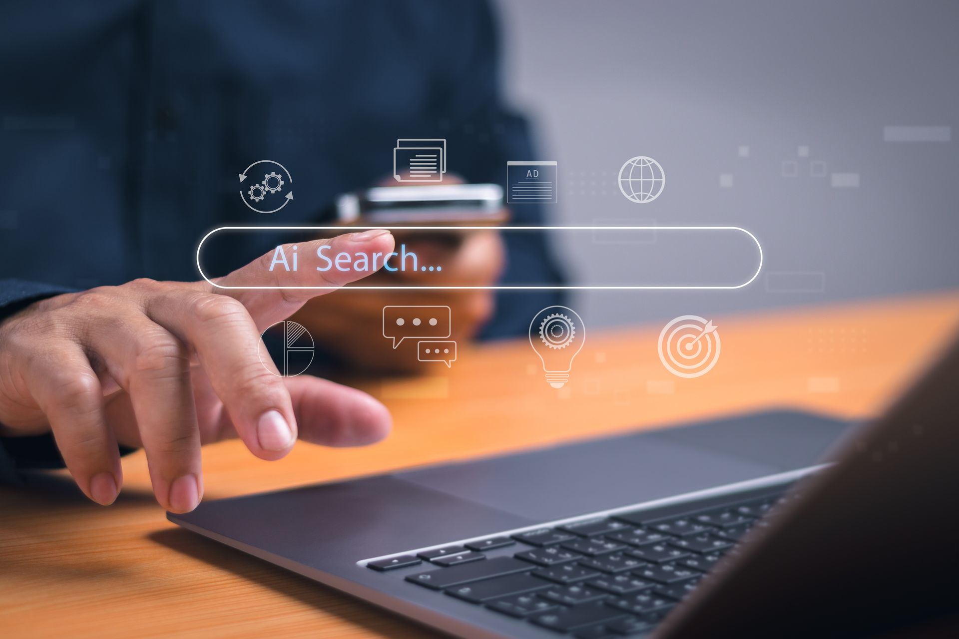 Hands typing on a laptop with a floating AI search bar and icons over a blurred office desk.