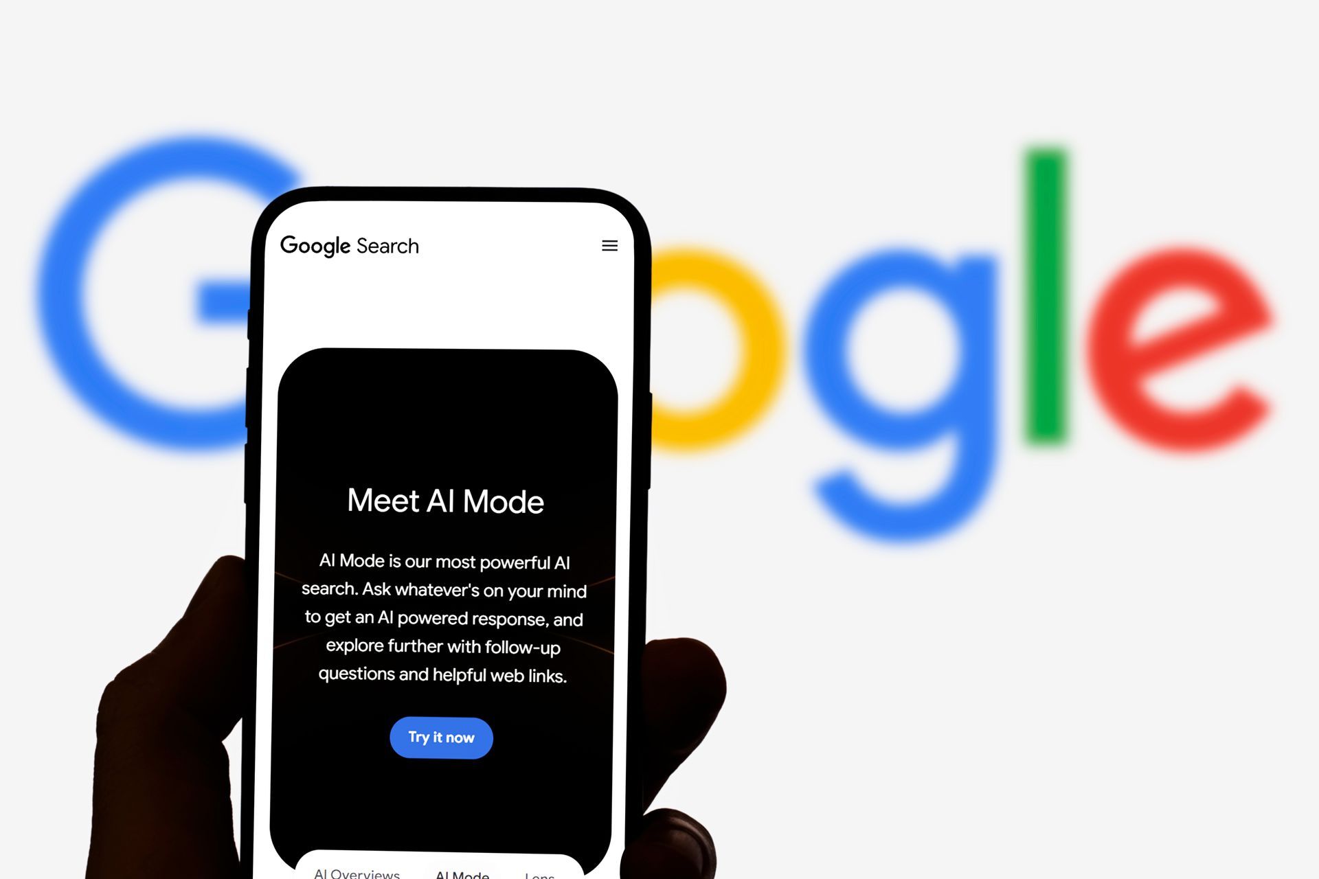 Hand holding a phone displaying 