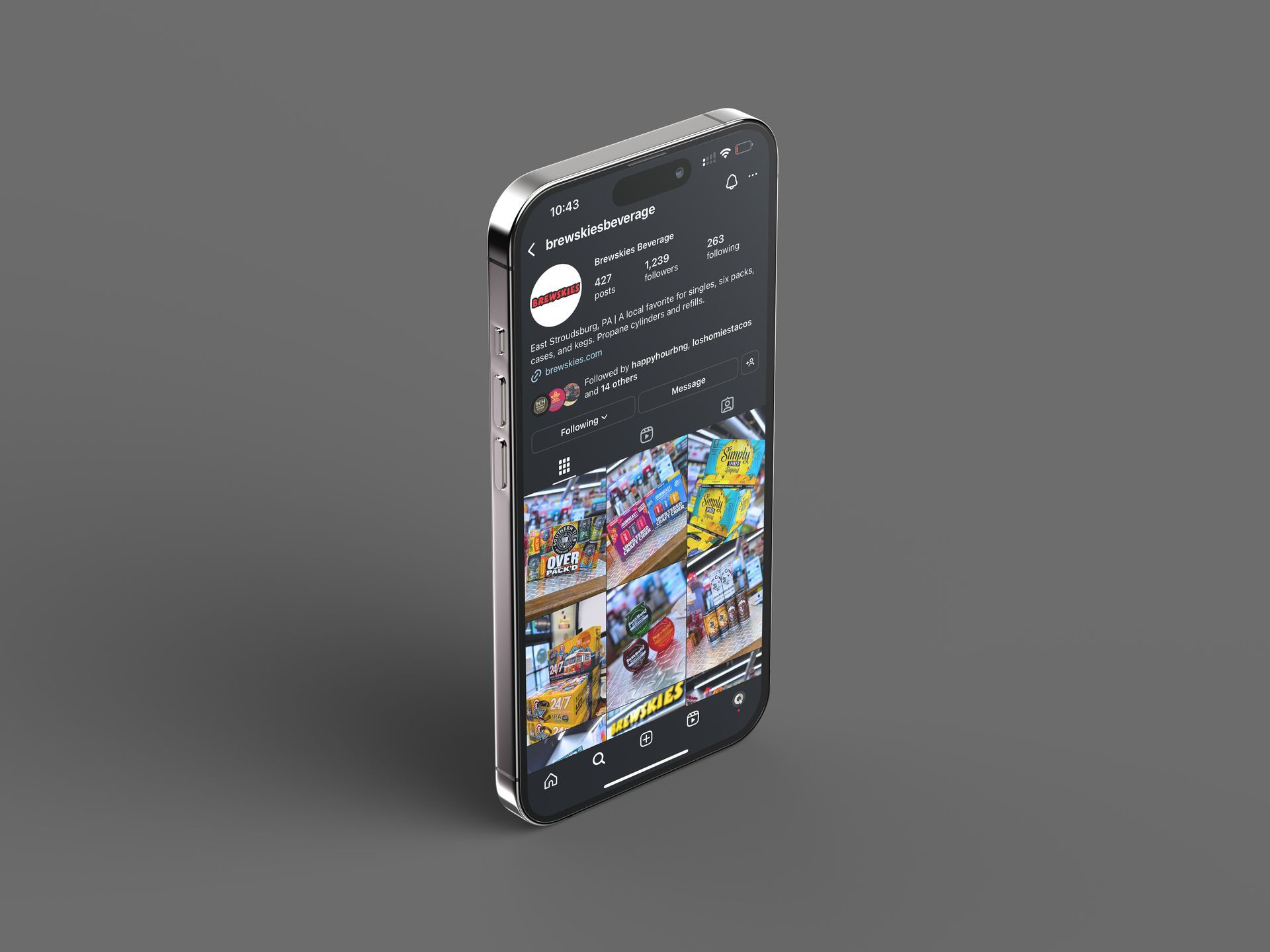 A cell phone is sitting on a gray surface.