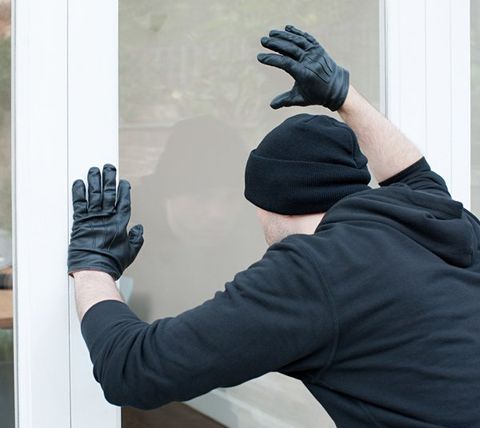 Burglar Looking Through Window — San Marcos, CA — Wyatt & Associates Protection Division