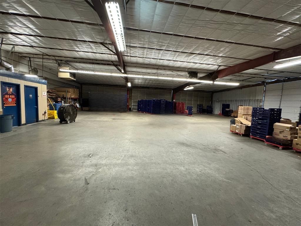 A large warehouse filled with lots of boxes and pallets.