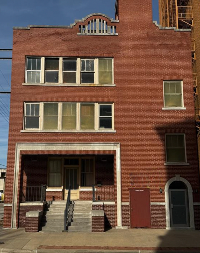 A brick building with the words price reduced on it