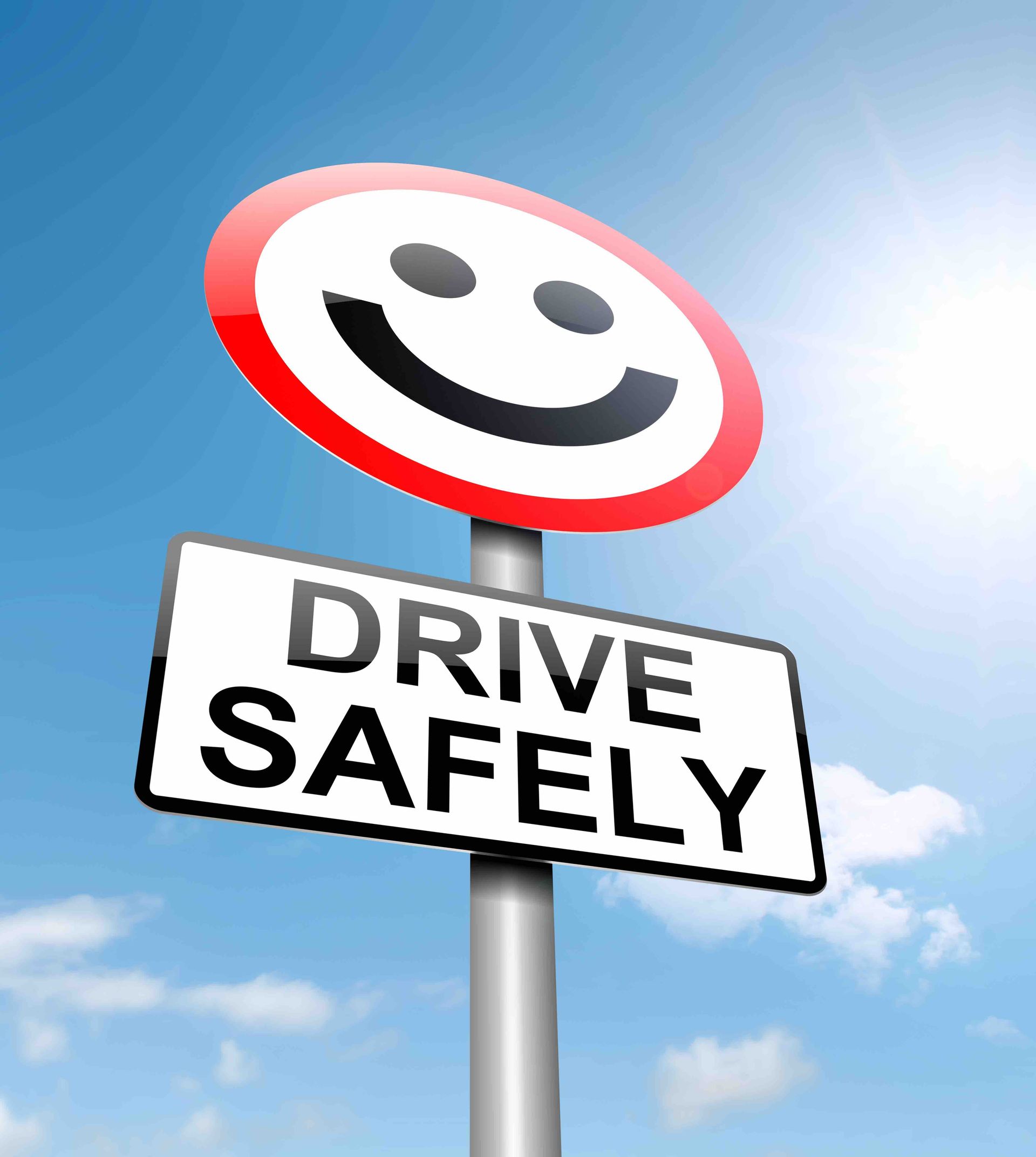 A sign that says drive safely with a smiley face on it
