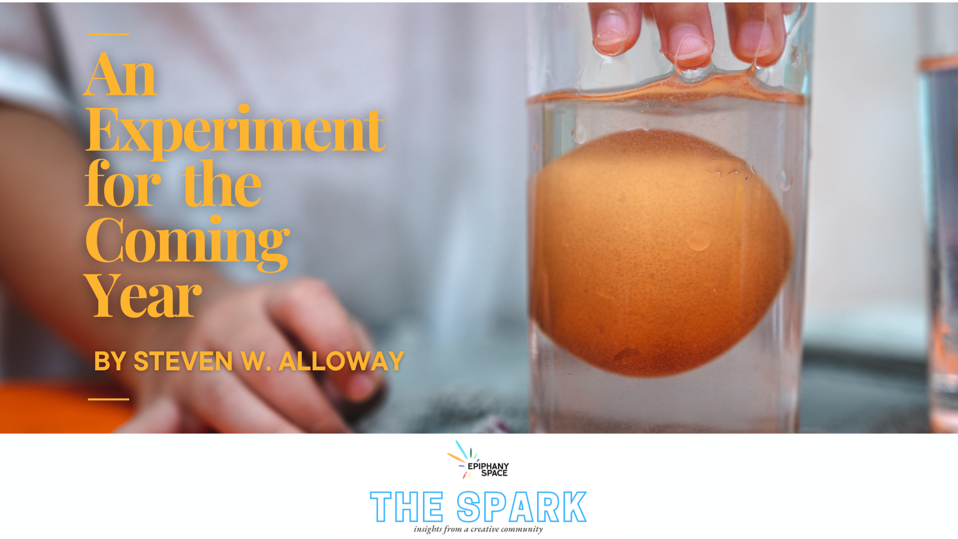 Egg suspended in a glass of water, symbolizing experimentation and reflection for the coming year