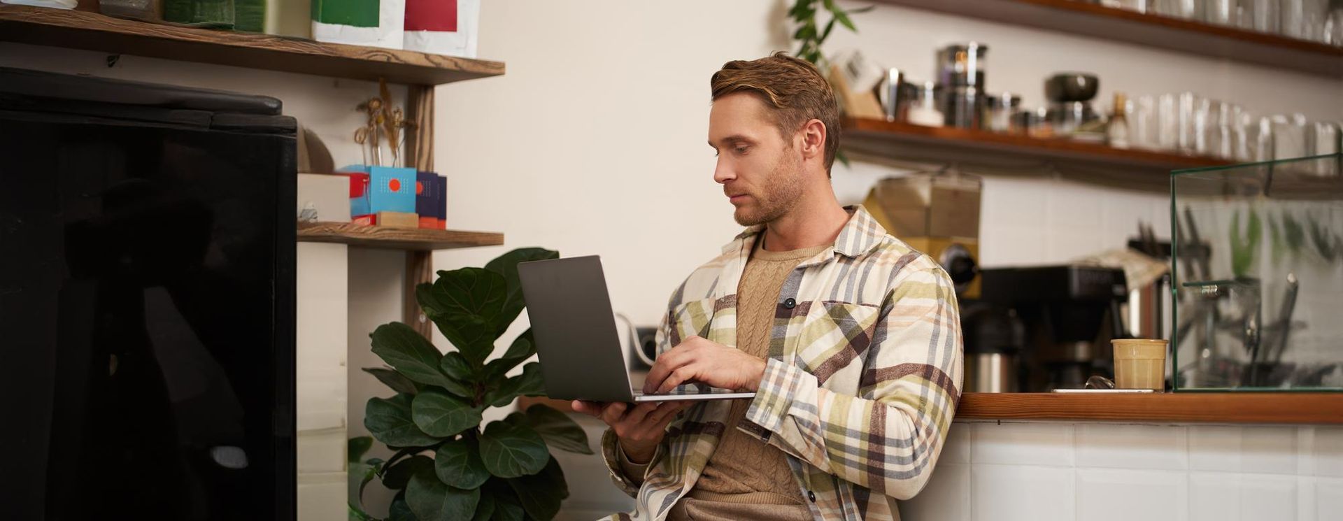 Business owner looking for insurance on his laptop