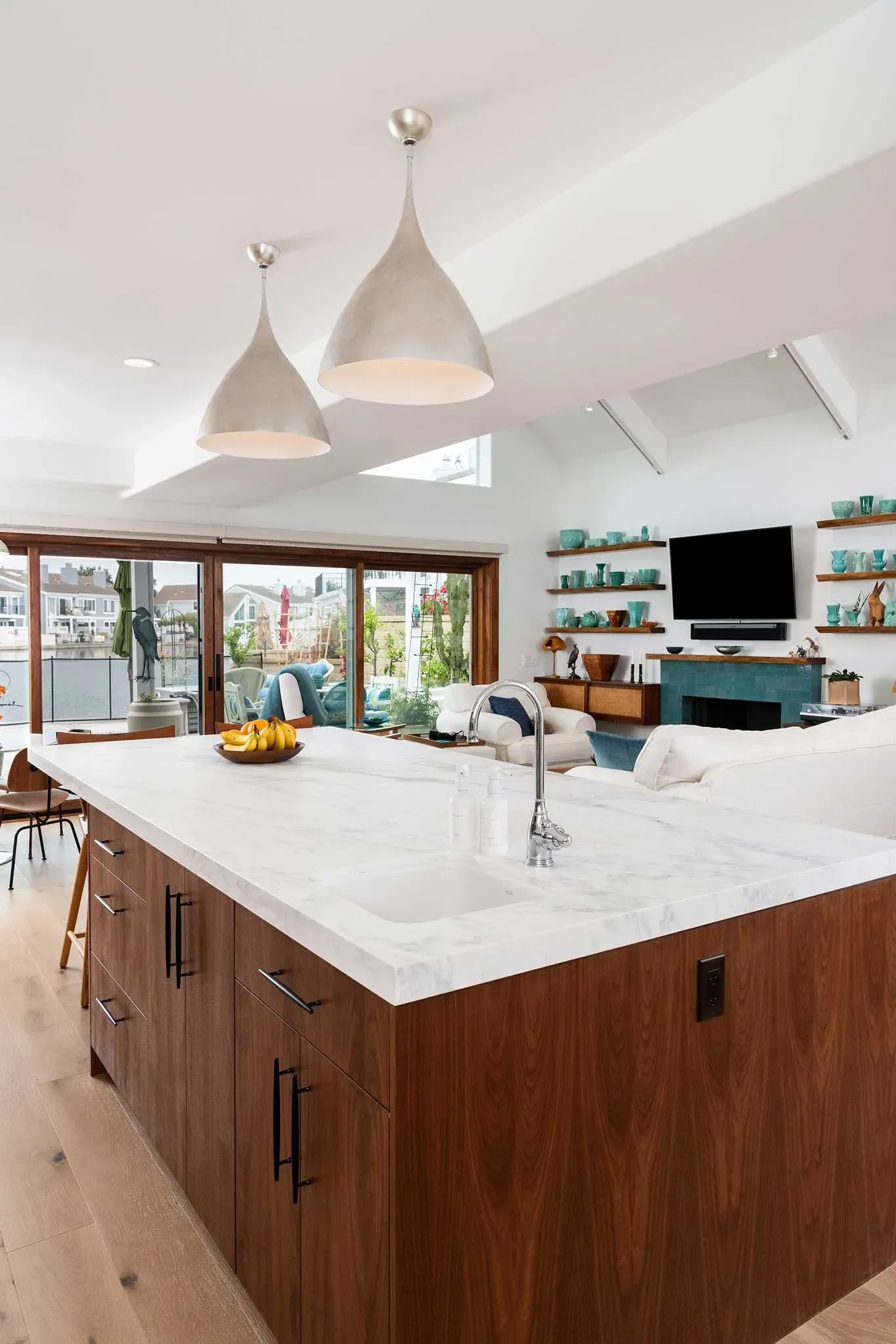 A kitchen with a large island and a sink