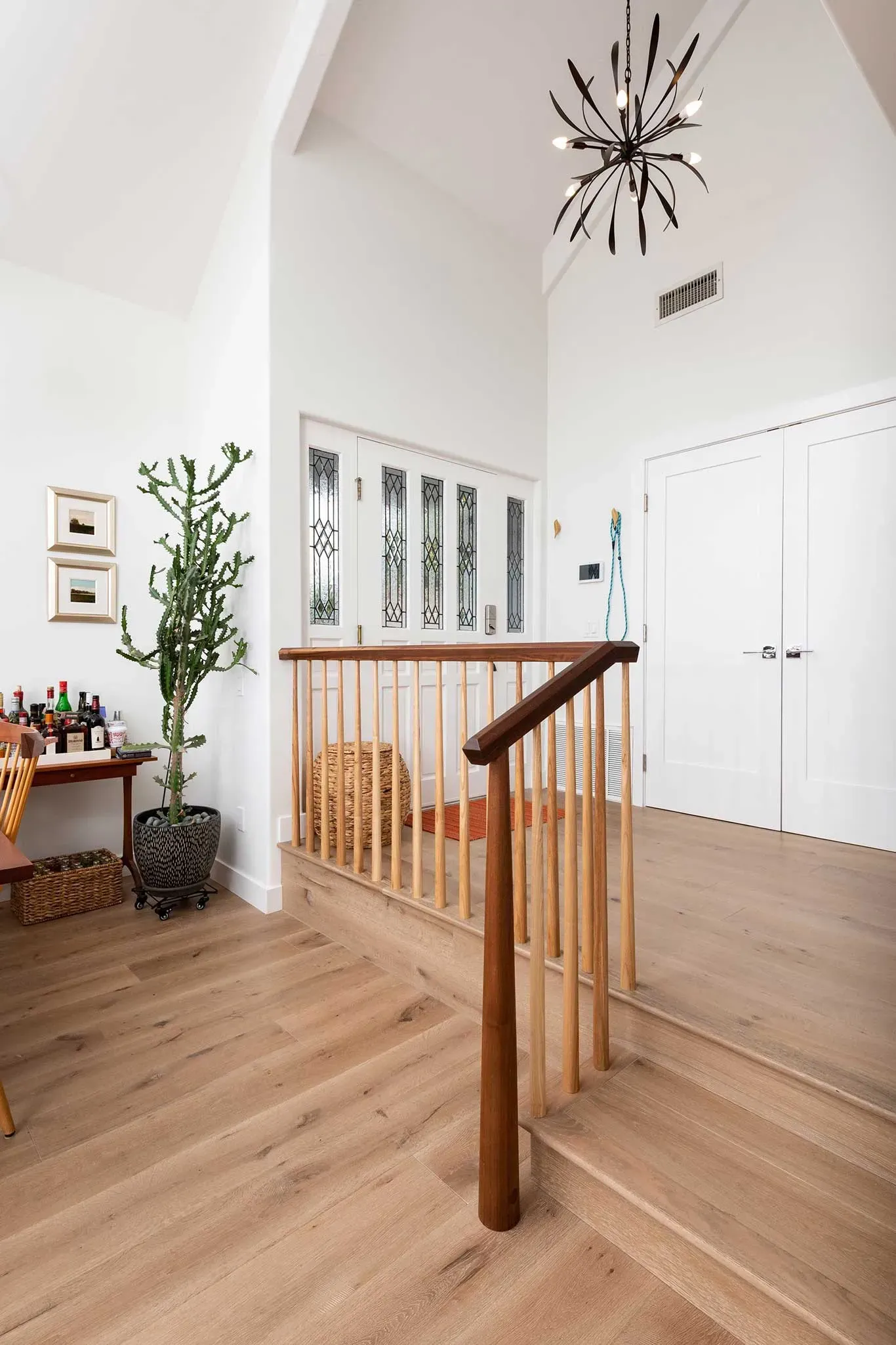 A wooden staircase leading up to a second floor in a house.