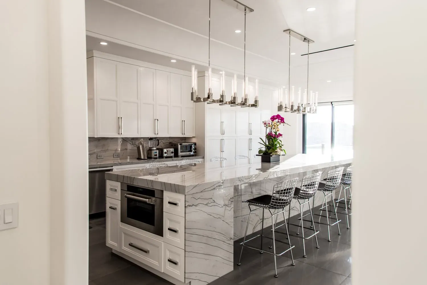 There is a large island in the middle of the kitchen.