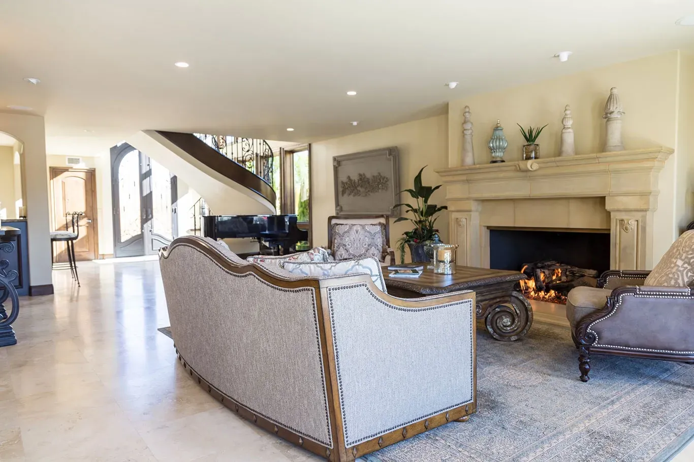 A living room filled with furniture and a fireplace.