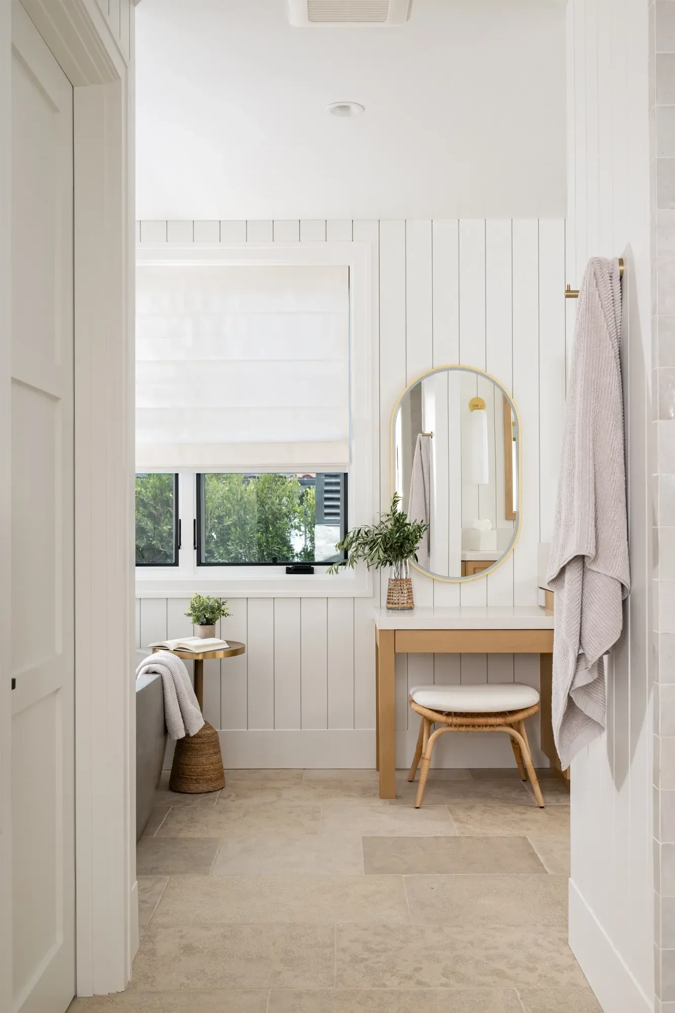 A bathroom with a vanity and a mirror.