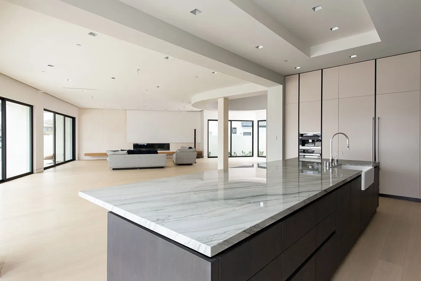 There is a large island in the middle of the kitchen.