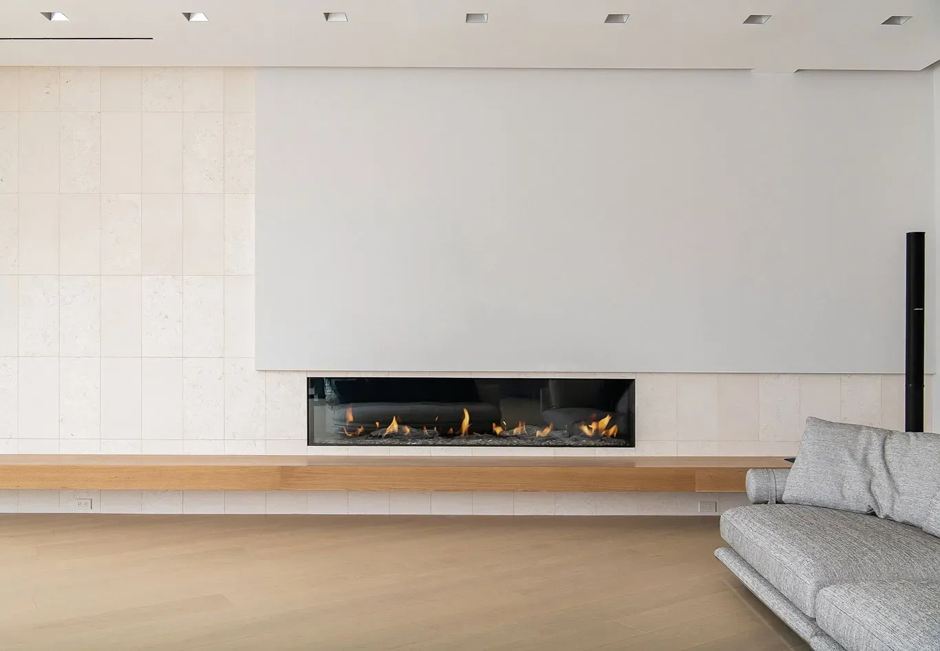 A living room with a fireplace and a couch.