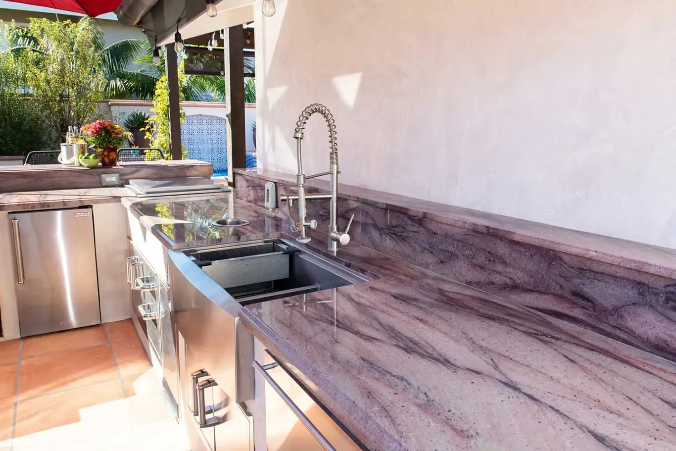A kitchen with stainless steel appliances and granite counter tops.
