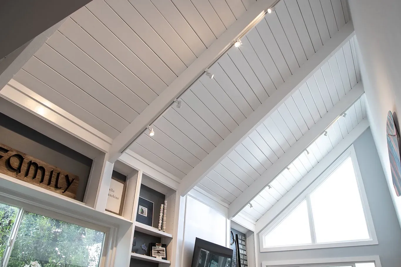 A white ceiling with a sign that says family on it