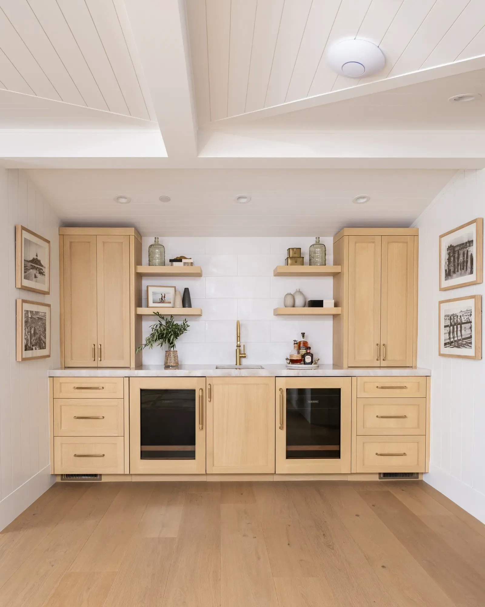 A kitchen with wooden cabinets and a refrigerator
