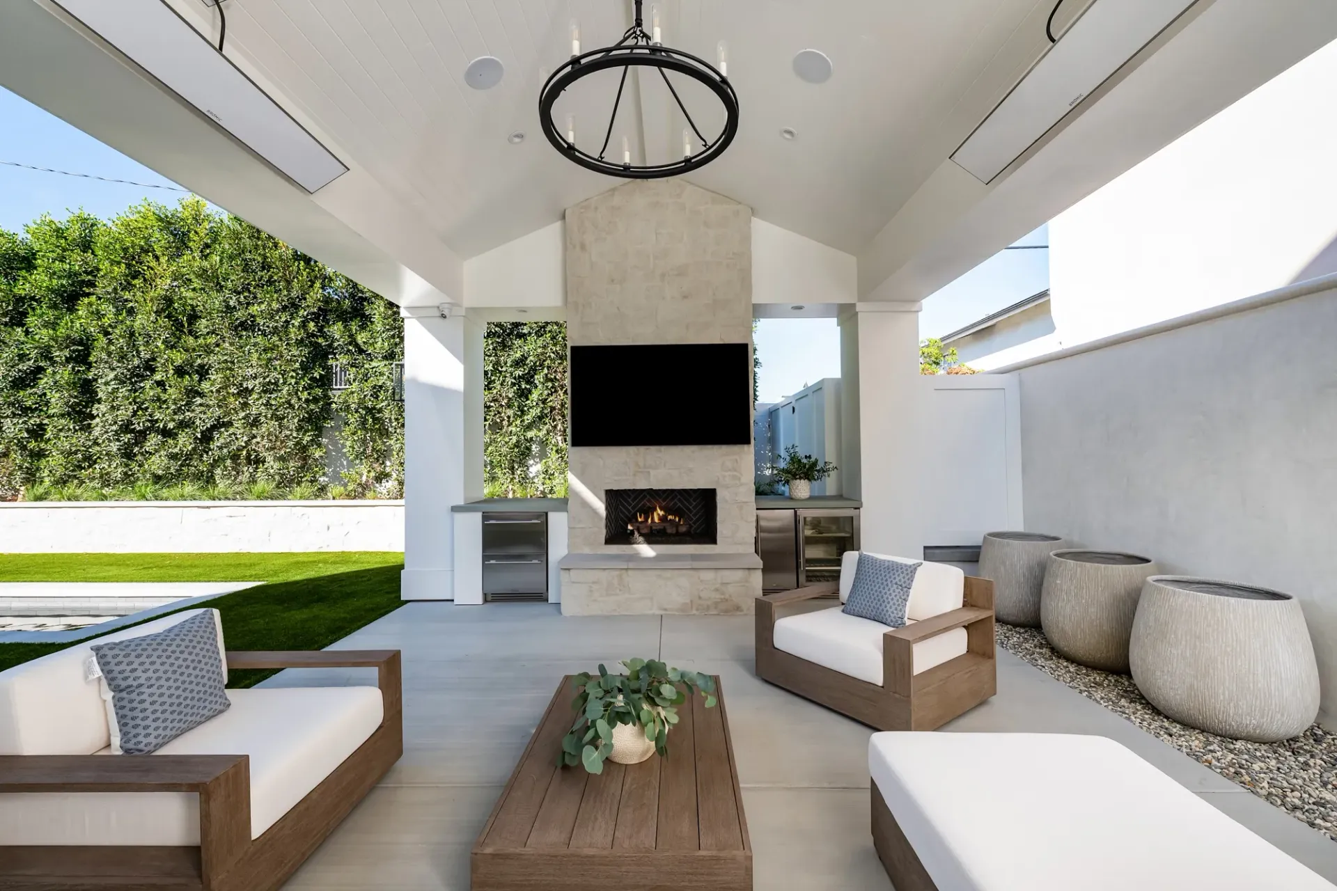 A living room with a fireplace and a flat screen tv
