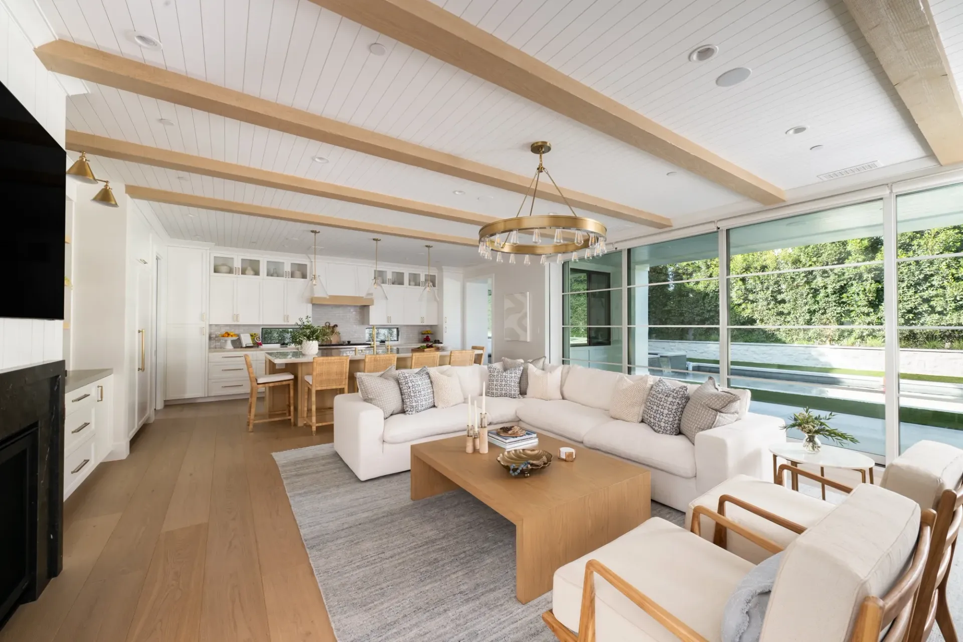 A living room with a couch , chairs , and a coffee table.