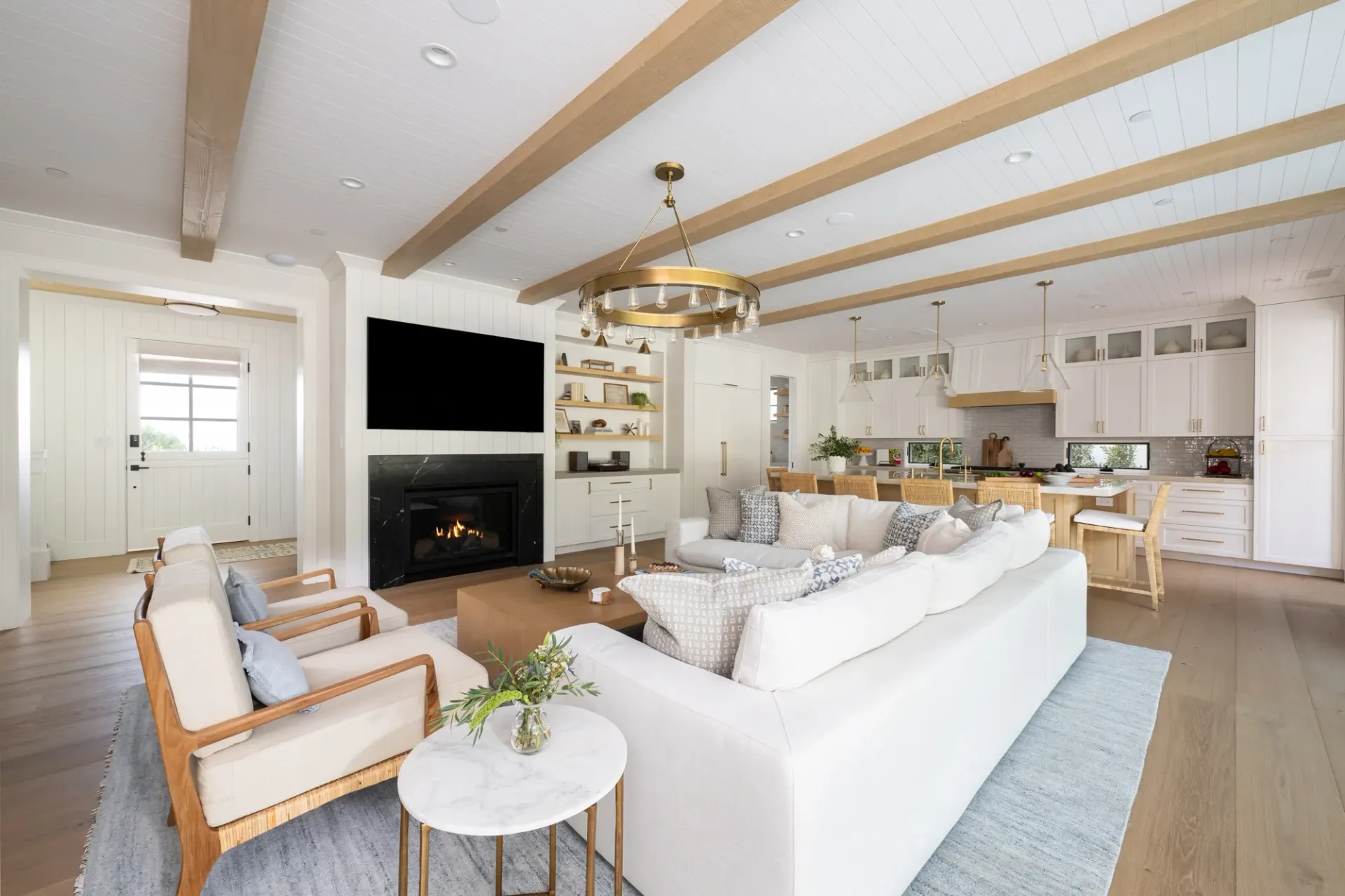 A living room filled with furniture and a fireplace.