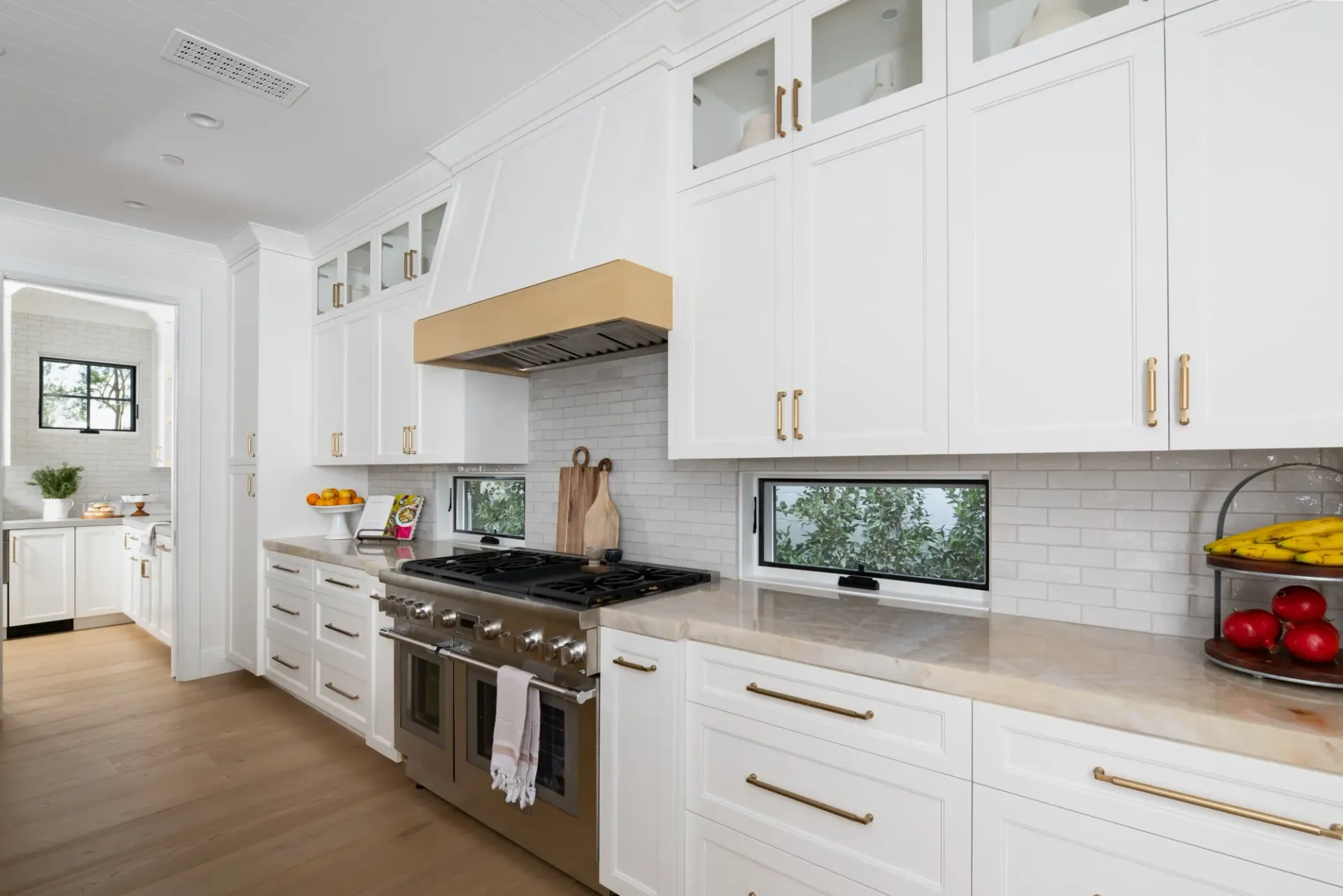 A kitchen with white cabinets and stainless steel appliances.