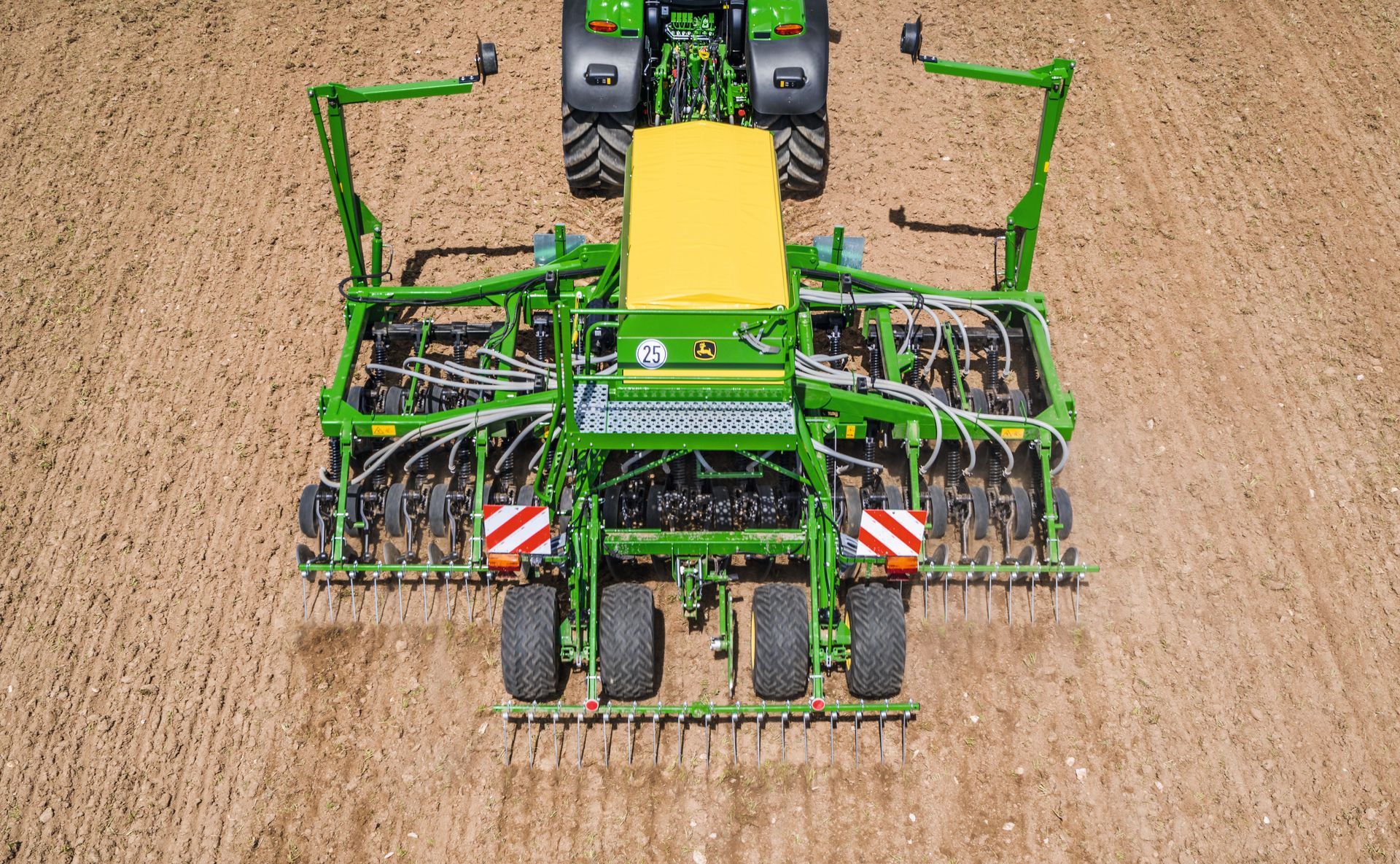 A John Deere tractor with planter equipment