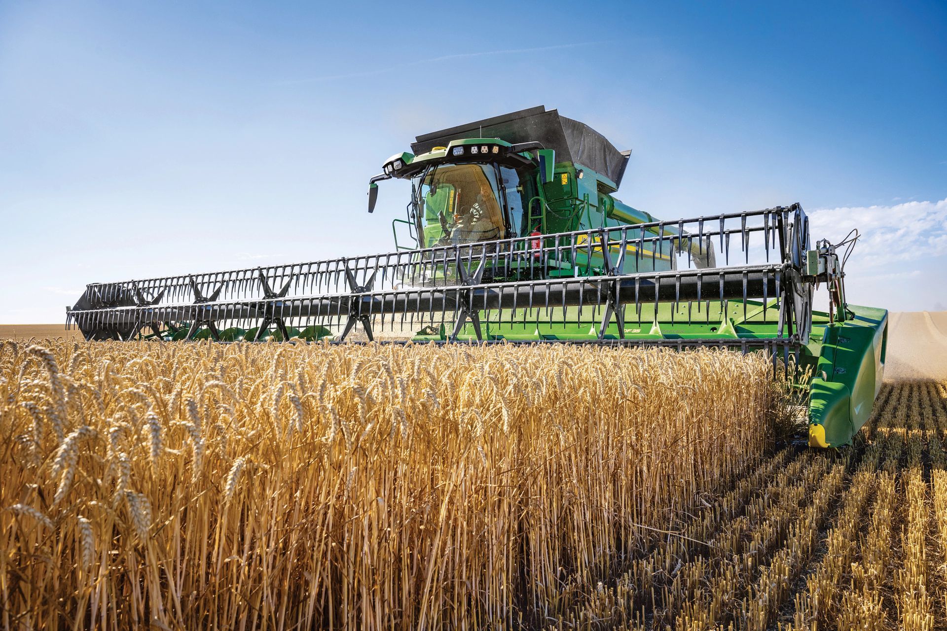 A John Deere combine in a wheat field