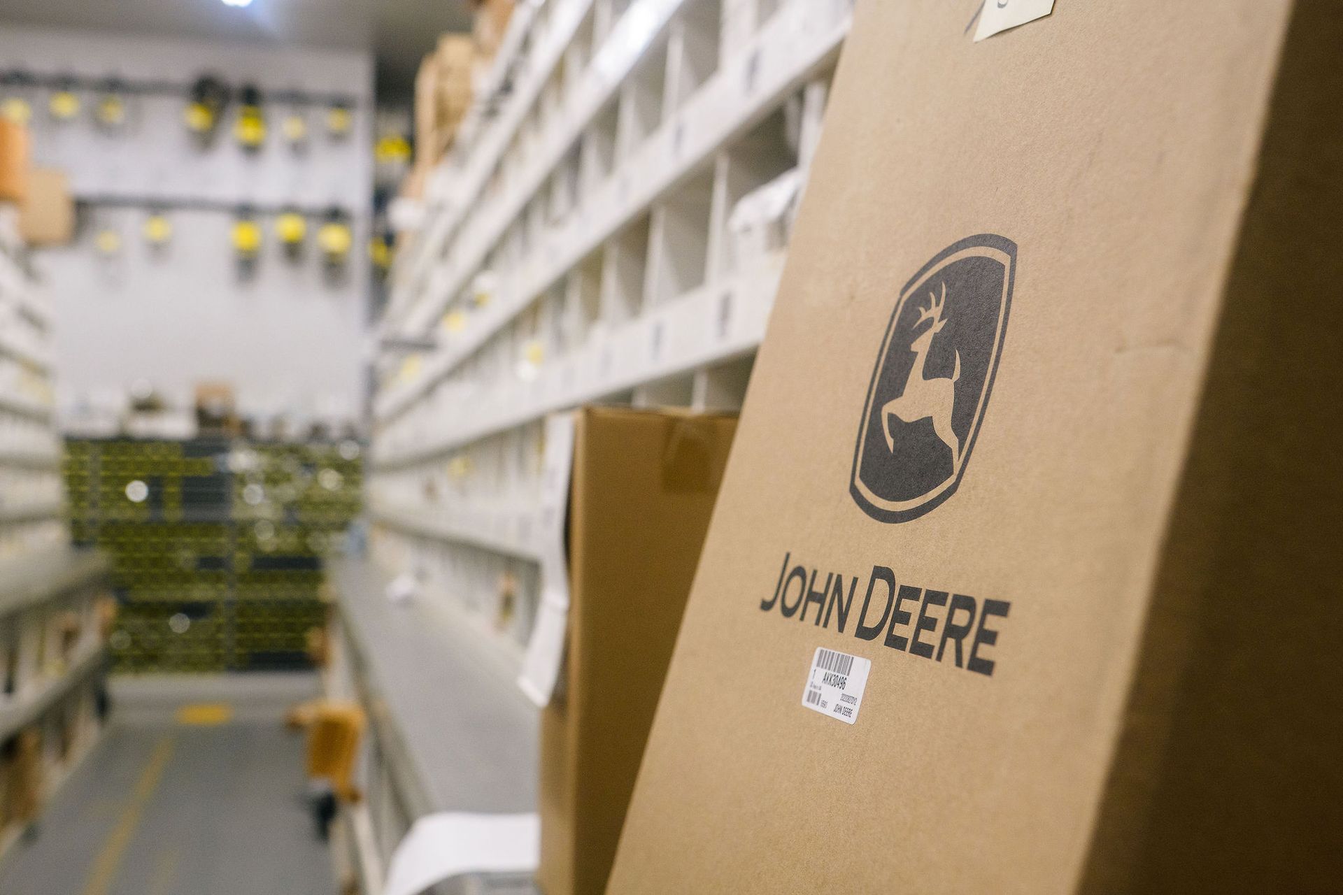 A john deere box is sitting in a warehouse.