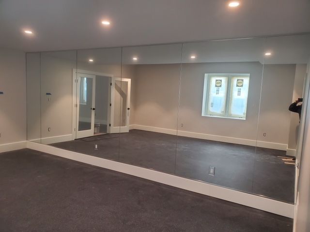 There is a large mirror in the middle of the room.