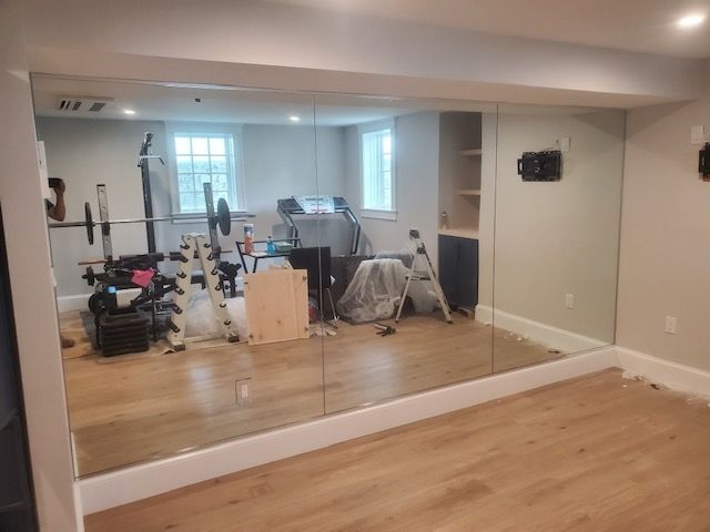 There is a large mirror in the middle of the room.