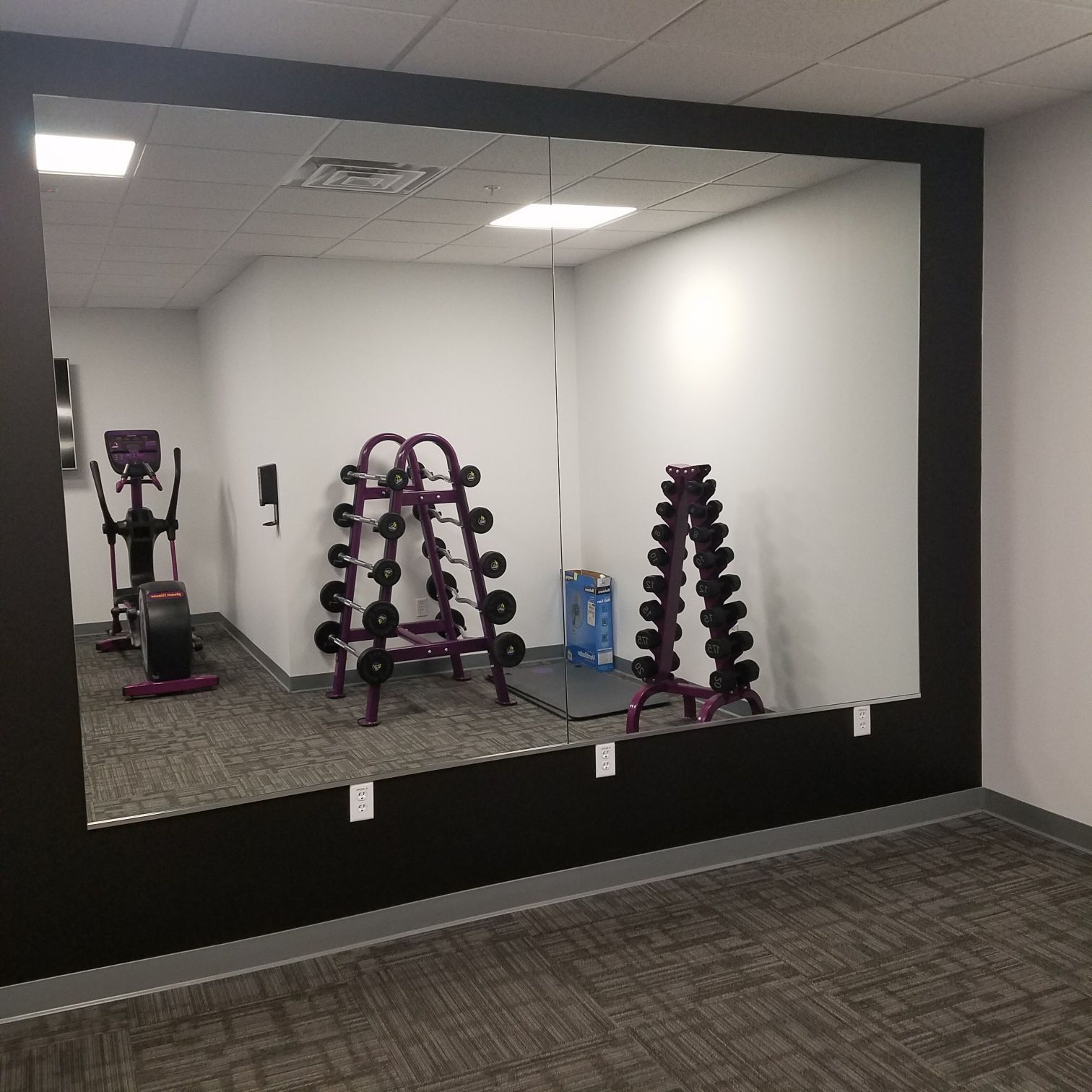 There is a large mirror in the middle of the room.