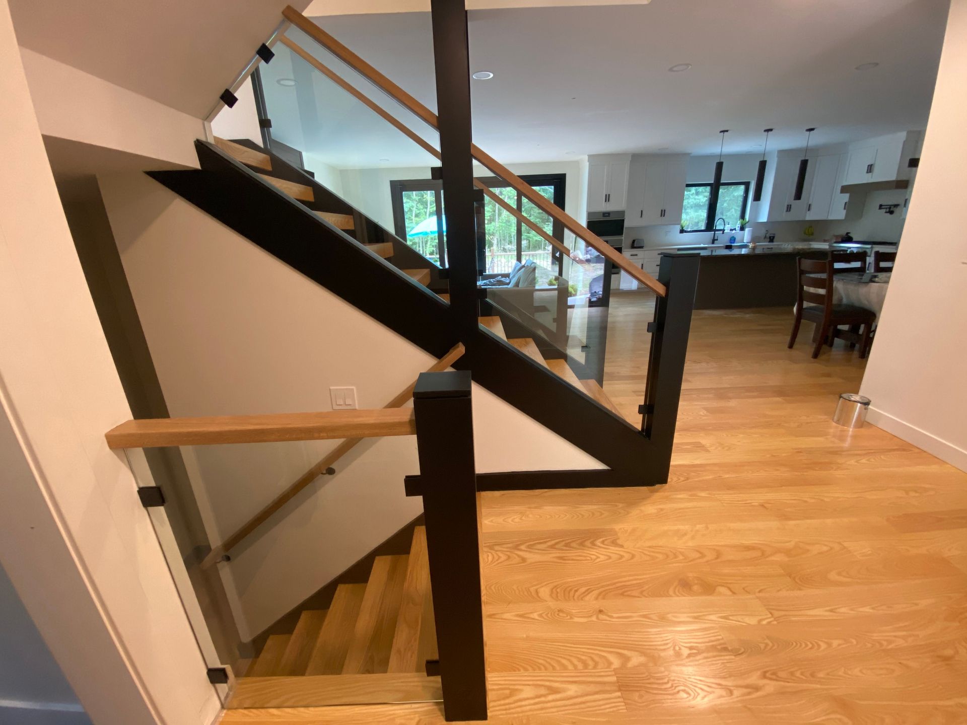 A staircase with a glass railing in a house