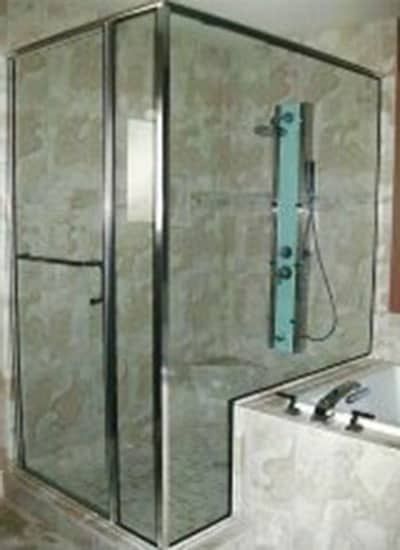 A bathroom with a walk in shower and a bathtub