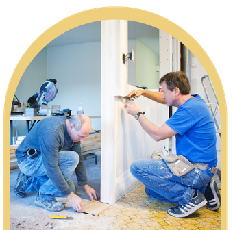 Two men are working on a door in a room
