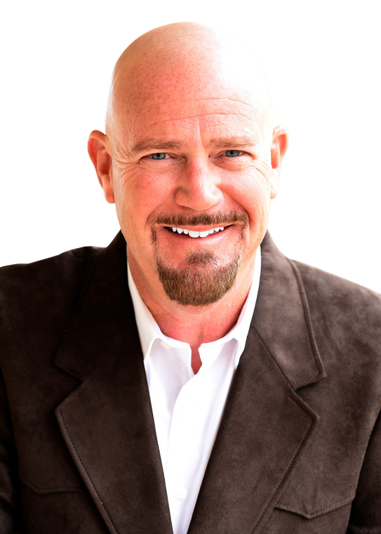 A bald man with a beard wearing a brown jacket and white shirt