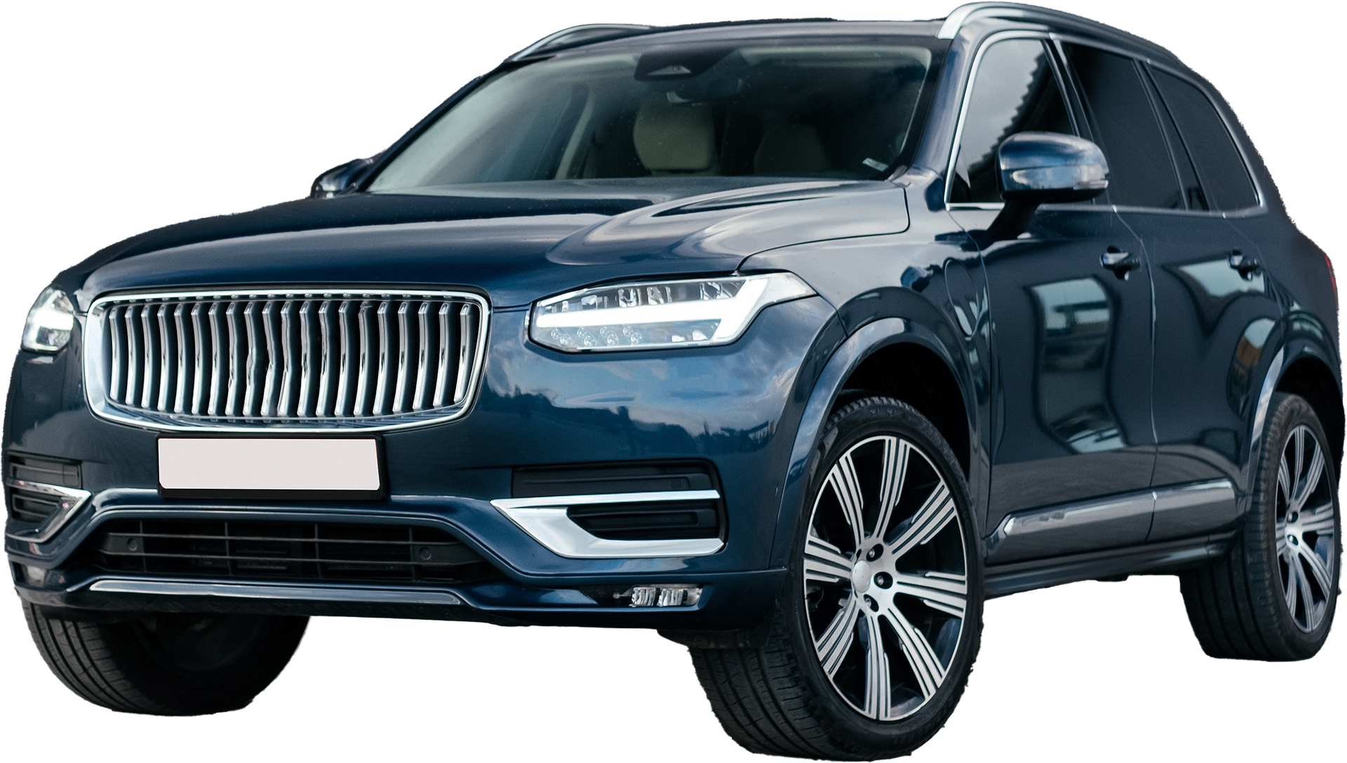 Blue Volvo SUV with chrome grill and large wheels.