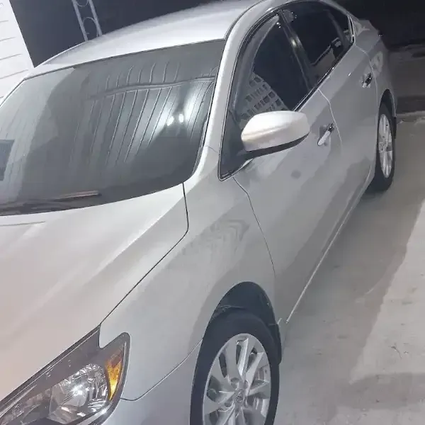 Silver sedan parked indoors.