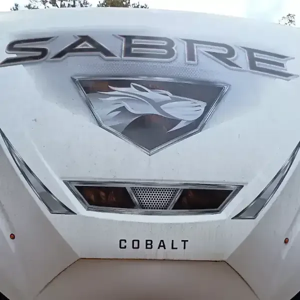 White Cobalt Sabre boat bow with logo and lights.