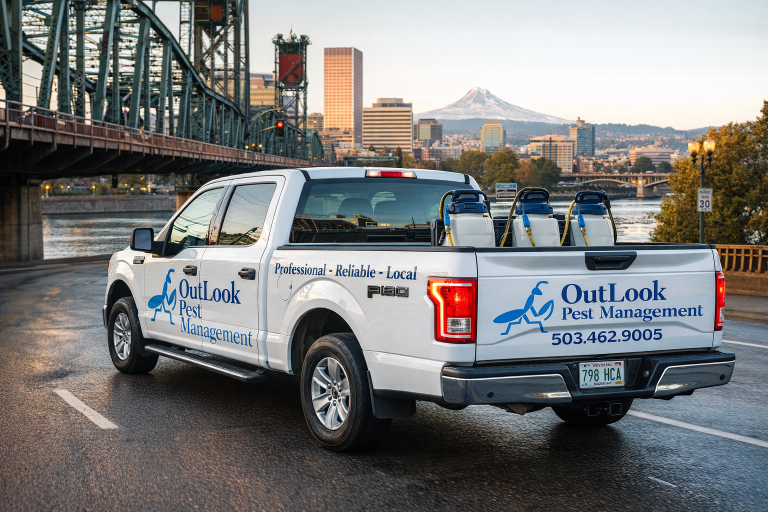 OutLook Pest Management service truck traveling through Portland, Oregon. White 2016 Ford F-150 truck with OutLook Pest Management branding driving through Portland, Oregon at dusk, carrying stainless pump sprayers in the bed, with the city skyline, bridge, and Mount Hood in the background.