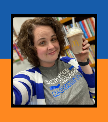 Woman holding a McDonald's shake, wearing a blue and white cardigan, and a gray t-shirt that says