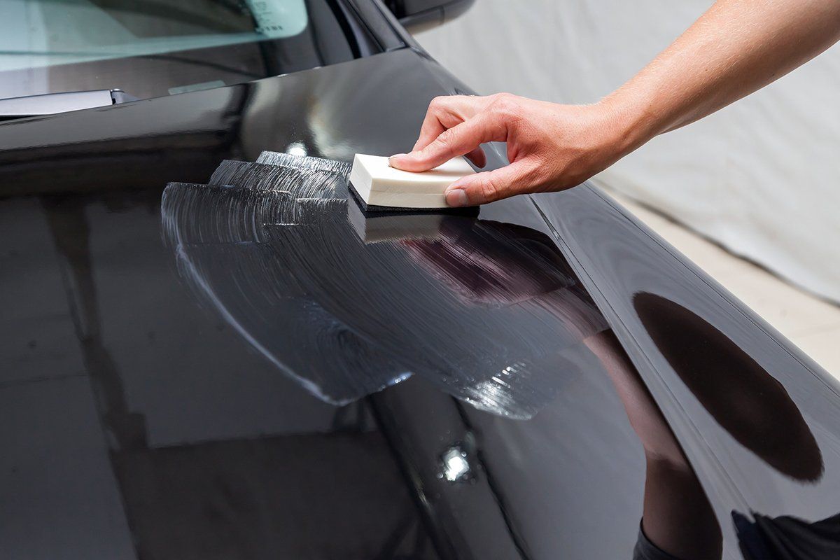 Person Applying Ceramic Coating On Car — Plymouth, MN — Sheen Auto Spa LLC