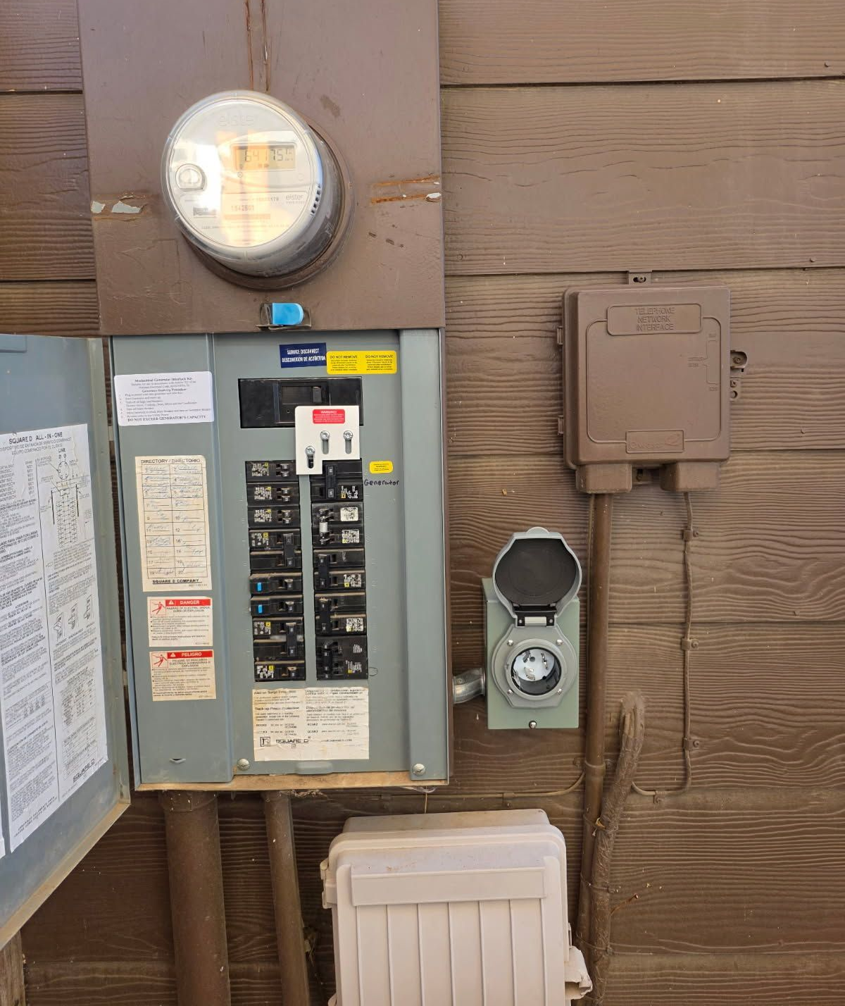 Ceiling fan with light fixture centered over a mirror, mounted on a white ceiling and walls.