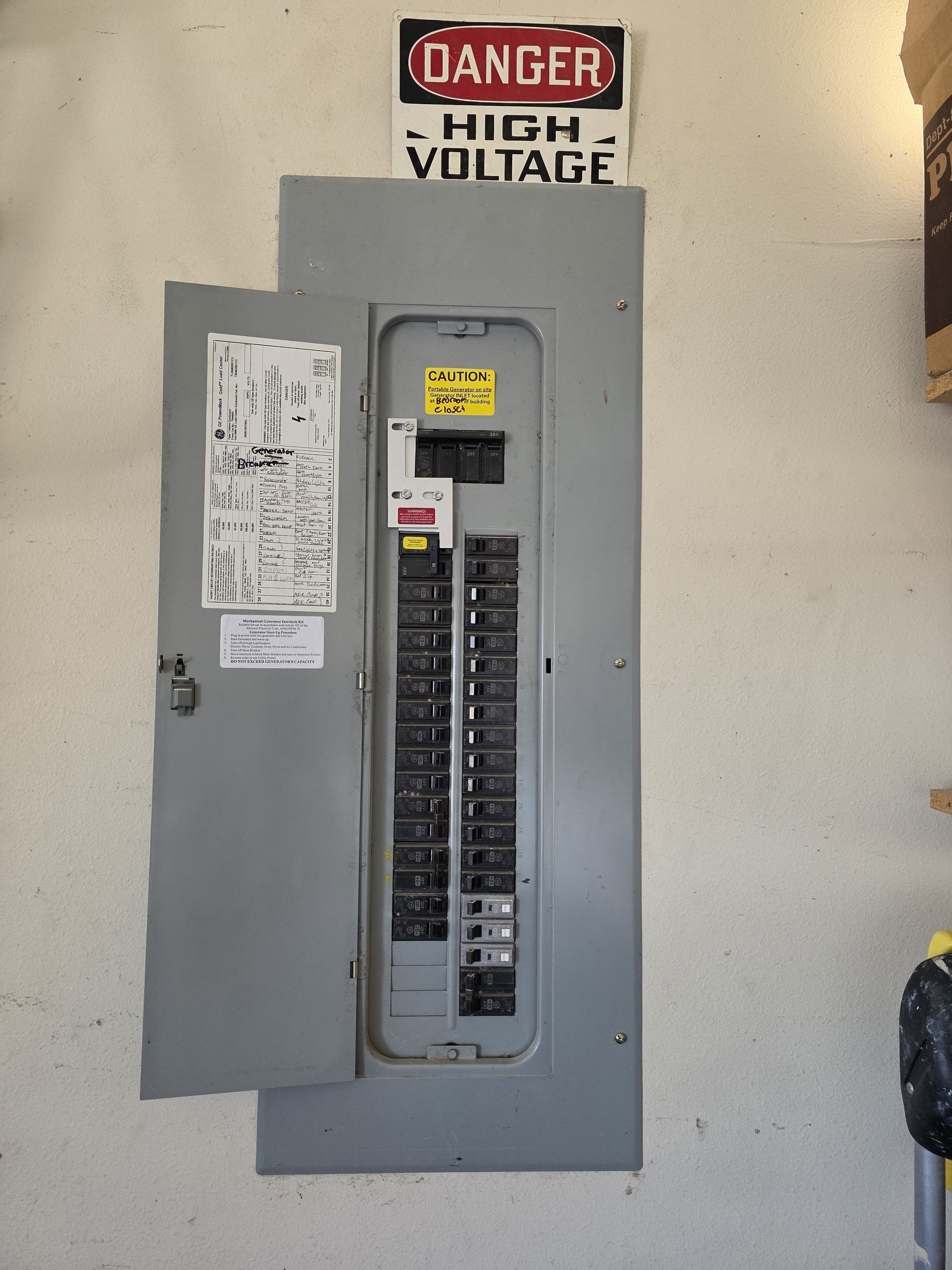 Ceiling fan with light fixture centered over a mirror, mounted on a white ceiling and walls.