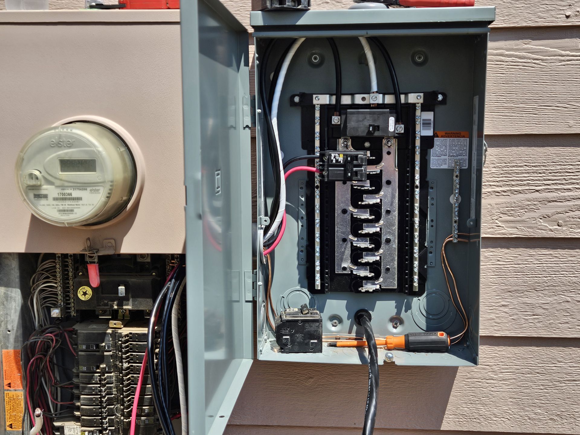Ceiling fan with light fixture centered over a mirror, mounted on a white ceiling and walls.