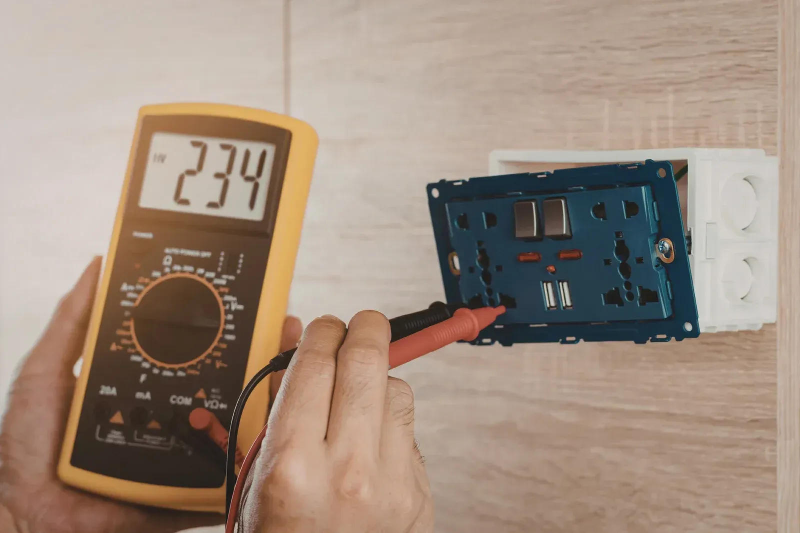 Ceiling fan with light fixture centered over a mirror, mounted on a white ceiling and walls.